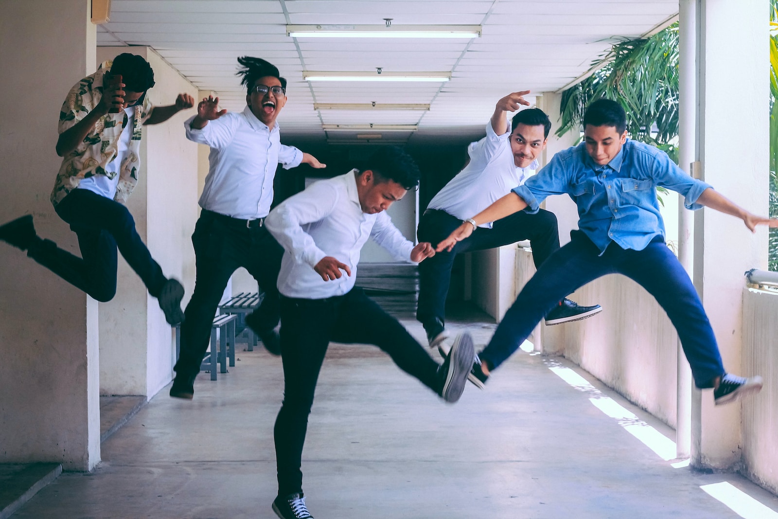 group of people doing jump shot photography